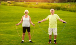 happy old people jumping rope